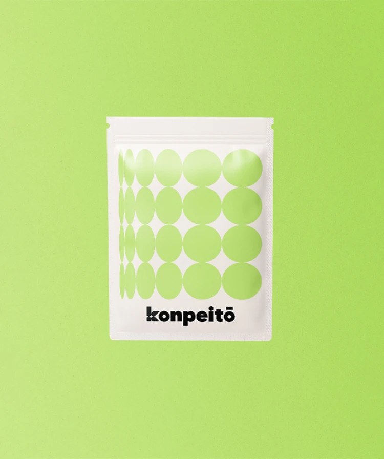 Ziplock packaging design for the Kompeito brand on a lime green background.