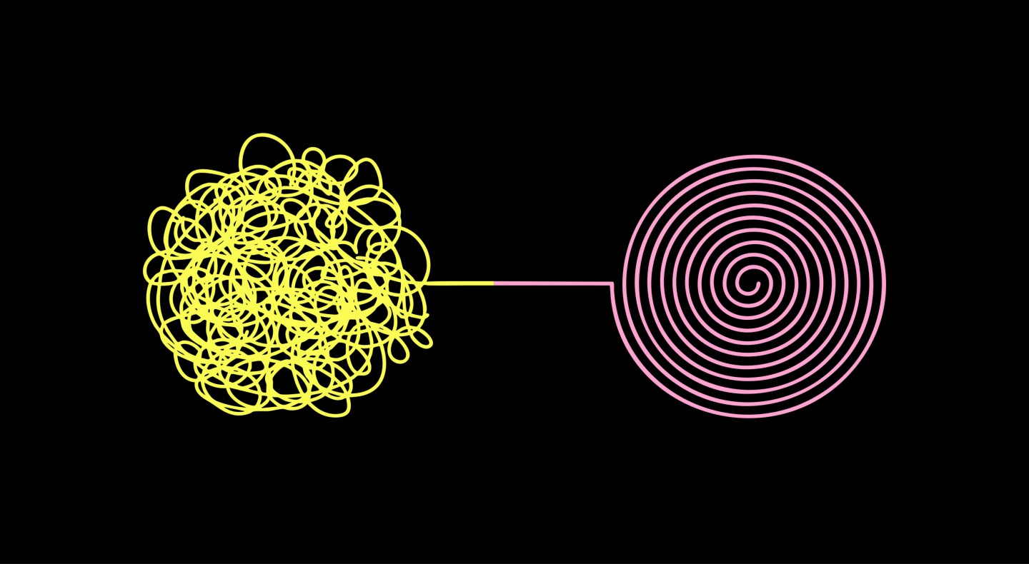 Scrambled yellow lines then arranged into a perfect pink swirl.